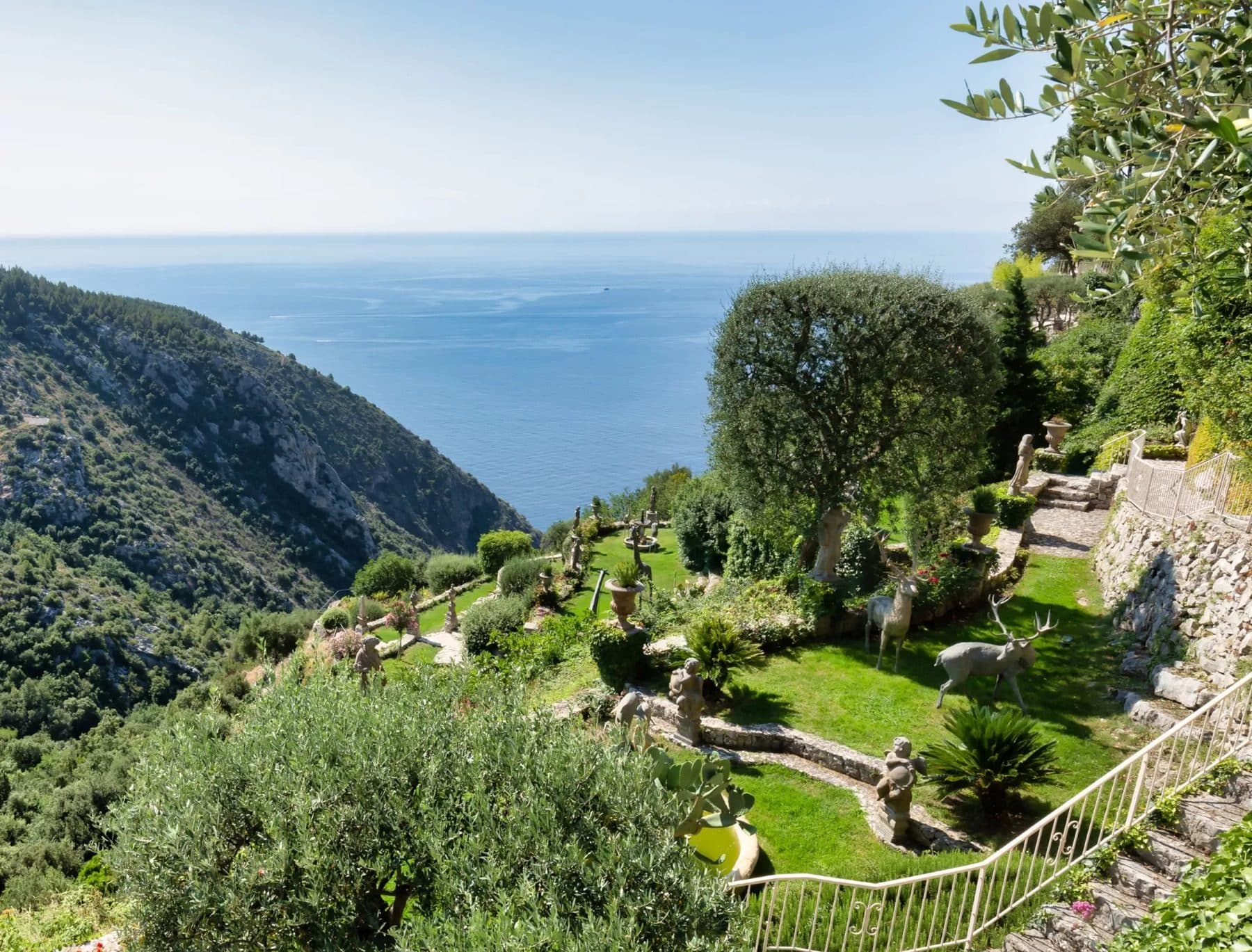 The terraced gardens stepping down the cliff