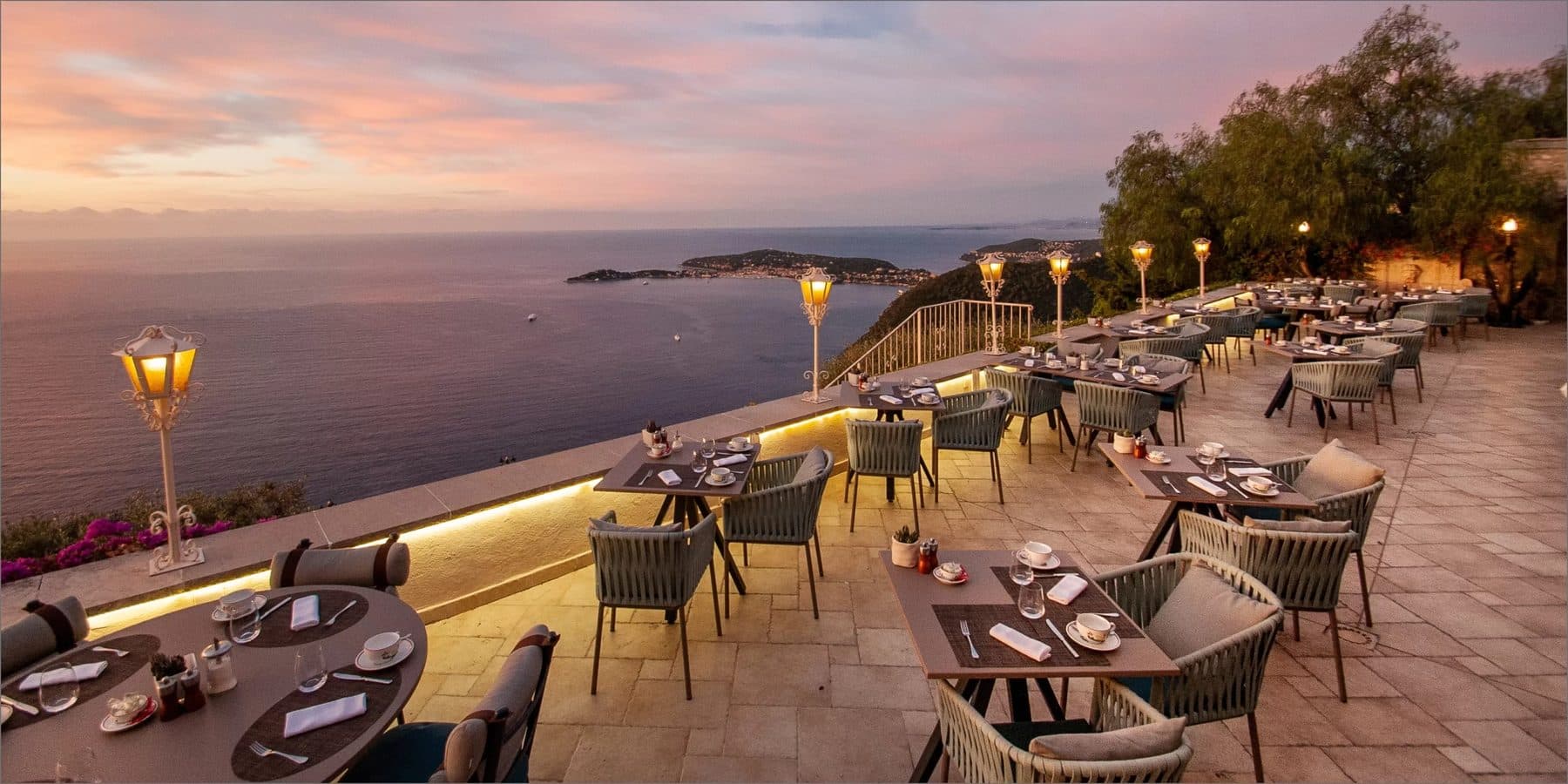 The cliff-edge dining terrace at sunset